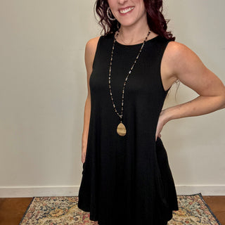 Black Sleeveless Dress with Button Details